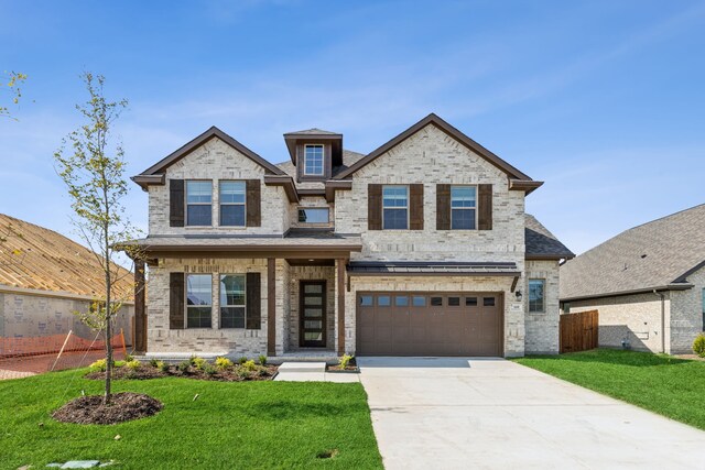 1105 Alaska, Forney, TX 75126 - view of front facade featuring driveway, an attached garage, and brick siding