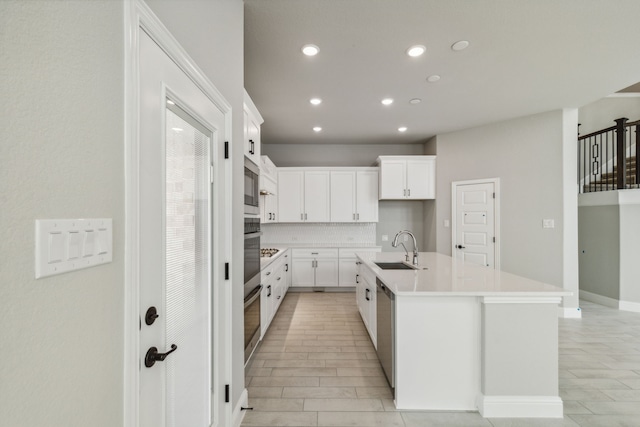 1105 Alaska, Forney, TX 75126 - kitchen with a sink, recessed lighting, tasteful backsplash, an island with sink, and light countertops