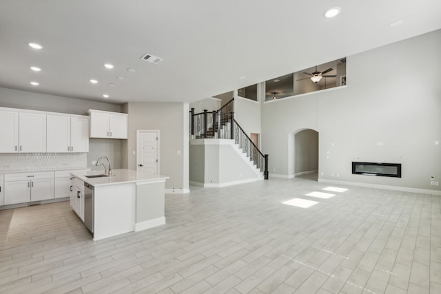 1105 Alaska, Forney, TX 75126 - kitchen with a sink, open floor plan, arched walkways, a ceiling fan, and recessed lighting