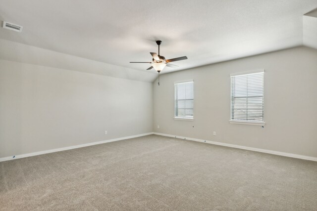 1105 Alaska, Forney, TX 75126 - spare room featuring light carpet, ceiling fan, lofted ceiling, and baseboards