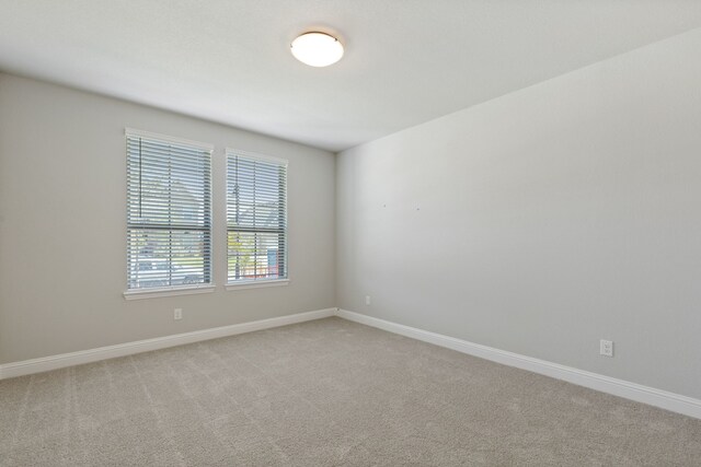 1105 Alaska, Forney, TX 75126 - unfurnished room with light carpet and baseboards