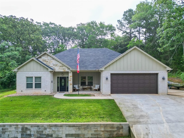 17294 Hidden Valley Ln, Flint, TX 75762 - ranch-style house with board and batten siding, an attached garage, a front lawn, concrete driveway, and brick siding