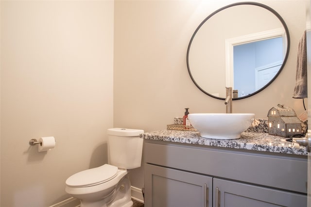17294 Hidden Valley Ln, Flint, TX 75762 - bathroom featuring baseboards, toilet, and vanity
