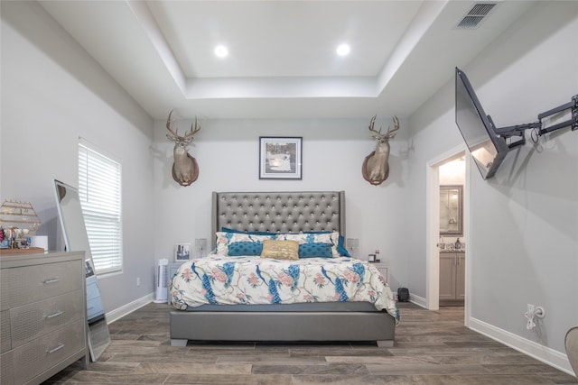 17294 Hidden Valley Ln, Flint, TX 75762 - bedroom with a raised ceiling, wood finished floors, baseboards, and recessed lighting