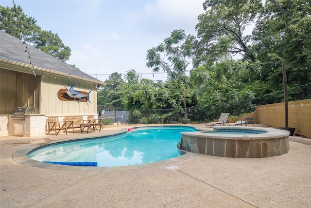 17294 Hidden Valley Ln, Flint, TX 75762 - view of swimming pool featuring exterior kitchen, a fenced backyard, a patio area, and a pool with connected hot tub
