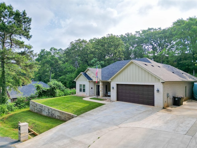 17294 Hidden Valley Ln, Flint, TX 75762 - view of front of house with a garage, board and batten siding, concrete driveway, and a front yard