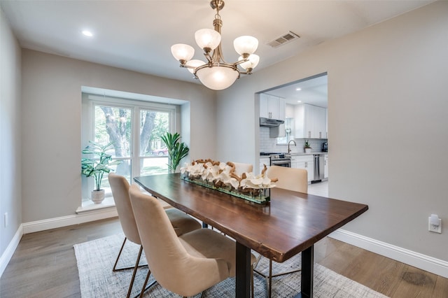 3385 Northaven Rd, Dallas, TX 75229 - dining space with a chandelier, baseboards, light wood-style flooring, and recessed lighting