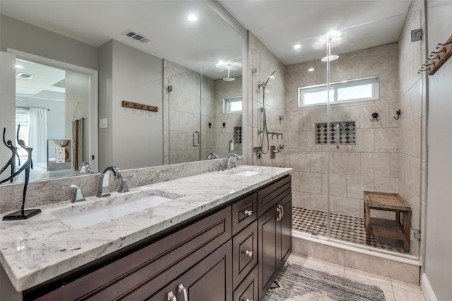 3385 Northaven Rd, Dallas, TX 75229 - bathroom with a shower stall, double vanity, tile patterned flooring, and plenty of natural light