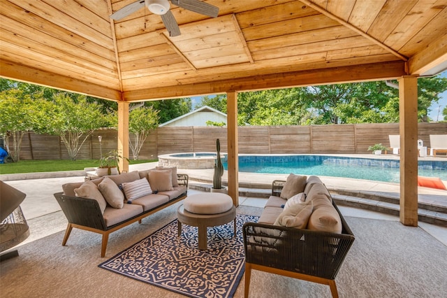 3385 Northaven Rd, Dallas, TX 75229 - fenced backyard with ceiling fan, a patio area, an outdoor living space, and a hot tub