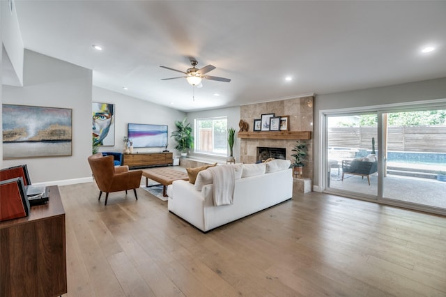 3385 Northaven Rd, Dallas, TX 75229 - living area featuring a ceiling fan, light wood-style flooring, a tile fireplace, baseboards, and recessed lighting