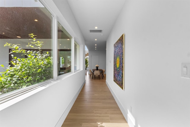 3941 Adrian Dr, Dallas, TX 75209 - hallway with wood finished floors, recessed lighting, and baseboards