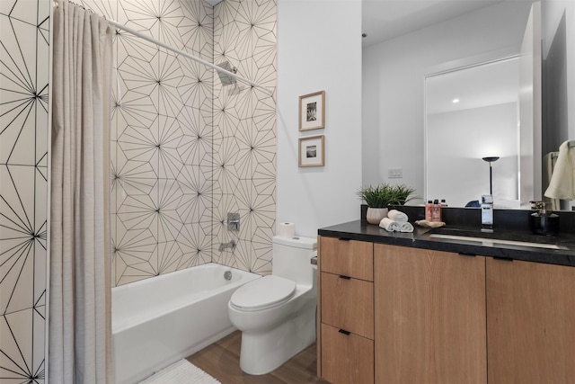 3941 Adrian Dr, Dallas, TX 75209 - full bath with vanity, toilet, shower / bath combo with shower curtain, and wood finished floors