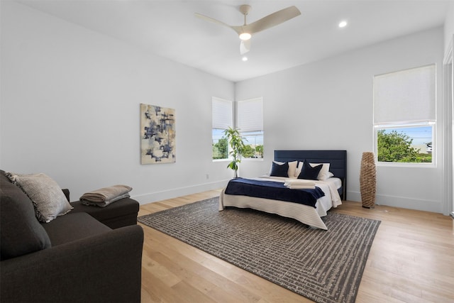 3941 Adrian Dr, Dallas, TX 75209 - bedroom with baseboards, light wood-style floors, recessed lighting, and ceiling fan