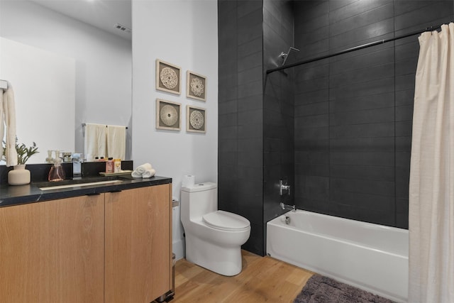 3941 Adrian Dr, Dallas, TX 75209 - bathroom with wood finished floors, vanity, toilet, and shower / bath combination with curtain