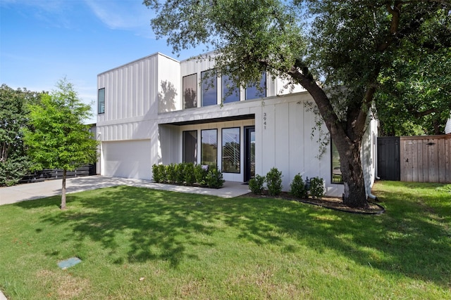 3941 Adrian Dr, Dallas, TX 75209 - view of front of home with an attached garage and concrete driveway