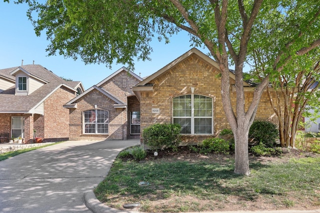 8208 Lonesome Spur Trl, Mckinney, TX 75070 - traditional home featuring brick siding and driveway