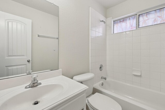8208 Lonesome Spur Trl, Mckinney, TX 75070 - bathroom featuring toilet, vanity, and shower / bathtub combination