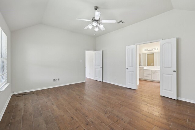 8208 Lonesome Spur Trl, Mckinney, TX 75070 - unfurnished bedroom with vaulted ceiling, wood finished floors, ceiling fan, and baseboards