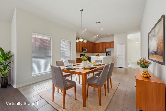 8208 Lonesome Spur Trl, Mckinney, TX 75070 - dining area featuring lofted ceiling and baseboards