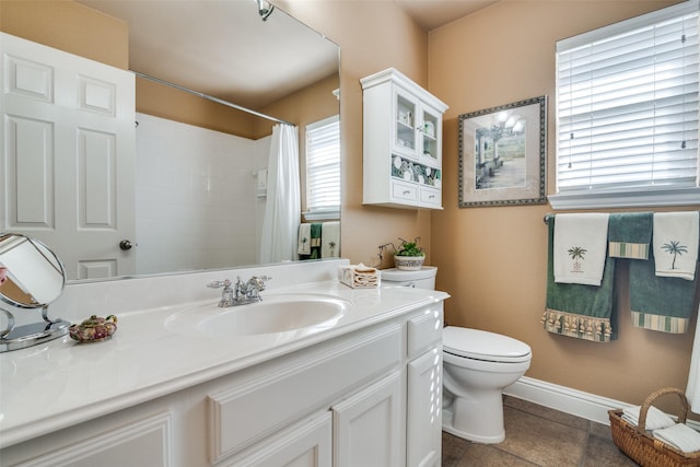 2345 Falls View Dr, Rockwall, TX 75087 - full bathroom featuring toilet, vanity, tile patterned floors, curtained shower, and baseboards
