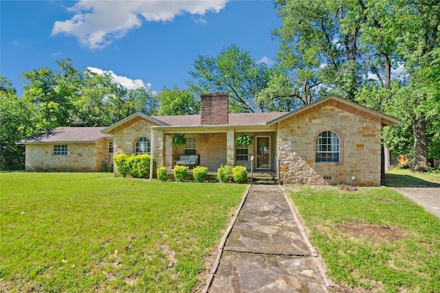 821 Columbia St, Beverly Hills, TX 76711 - ranch-style house with stone siding, a porch, a chimney, and a front lawn