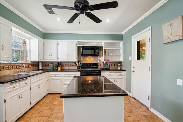 821 Columbia St, Beverly Hills, TX 76711 - kitchen featuring black appliances, a sink, tasteful backsplash, stone tile floors, and crown molding