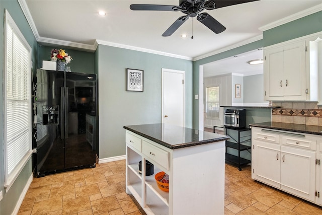 821 Columbia St, Beverly Hills, TX 76711 - kitchen featuring black refrigerator with ice dispenser, a ceiling fan, decorative backsplash, white cabinetry, and baseboards