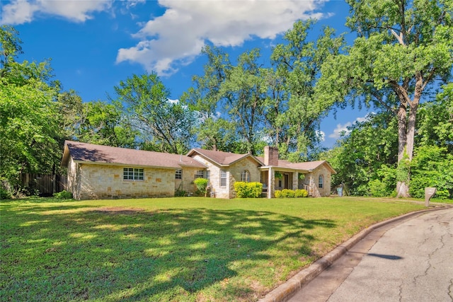 821 Columbia St, Beverly Hills, TX 76711 - single story home with a chimney and stone siding
