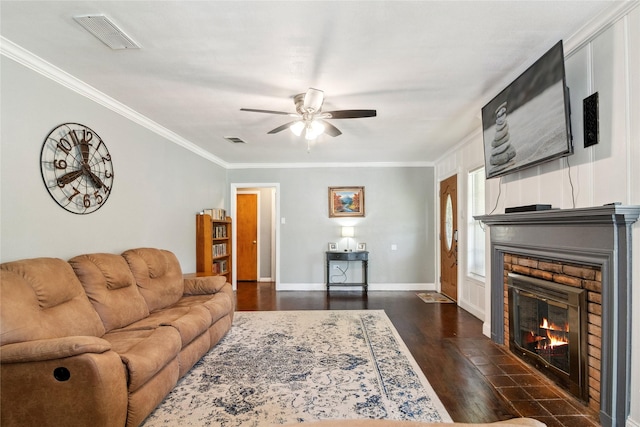 821 Columbia St, Beverly Hills, TX 76711 - living area with ceiling fan, dark wood-style floors, crown molding, a fireplace with flush hearth, and baseboards