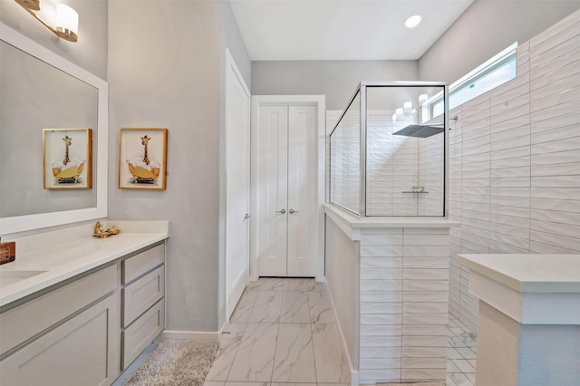 3580 Spruce Hills St, Frisco, TX 75033 - bathroom featuring marble look tile flooring, walk in shower, vanity, and baseboards