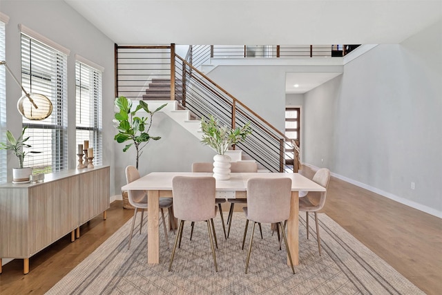 3580 Spruce Hills St, Frisco, TX 75033 - dining room with baseboards, light wood finished floors, and stairway