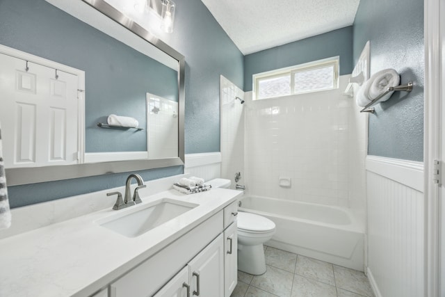 4433 Buchanan Dr, Plano, TX 75024 - bathroom with vanity, shower / tub combination, toilet, a wainscoted wall, and a textured ceiling