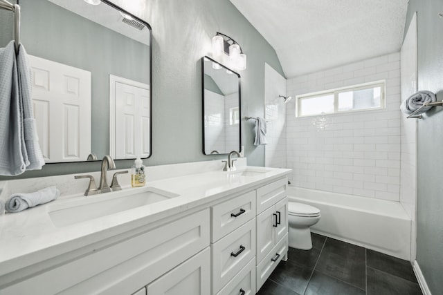 4433 Buchanan Dr, Plano, TX 75024 - full bath featuring double vanity, toilet, bathtub / shower combination, tile patterned floors, and vaulted ceiling