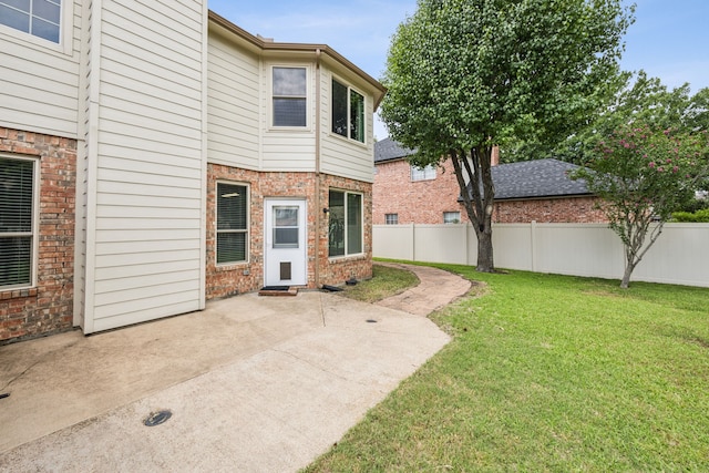 4433 Buchanan Dr, Plano, TX 75024 - back of property with brick siding and a patio area