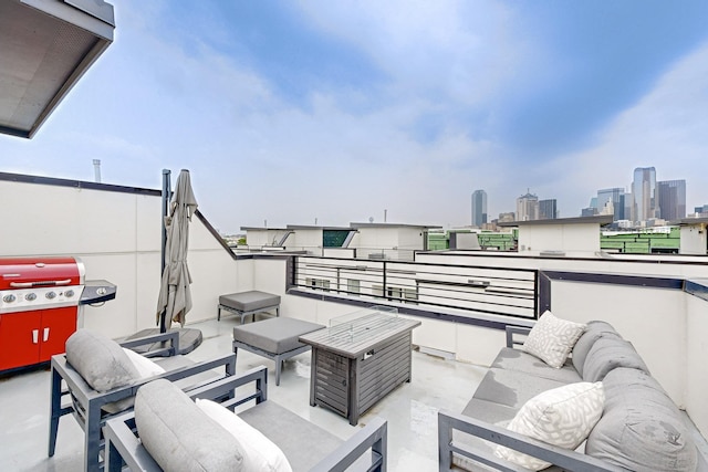 1813 Park Ave Unit 204, Dallas, TX 75215 - view of patio with an outdoor hangout area, a skyline view, and a balcony