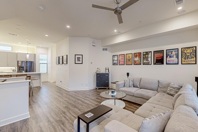 1813 Park Ave Unit 204, Dallas, TX 75215 - living area featuring wood finished floors, a ceiling fan, recessed lighting, and baseboards