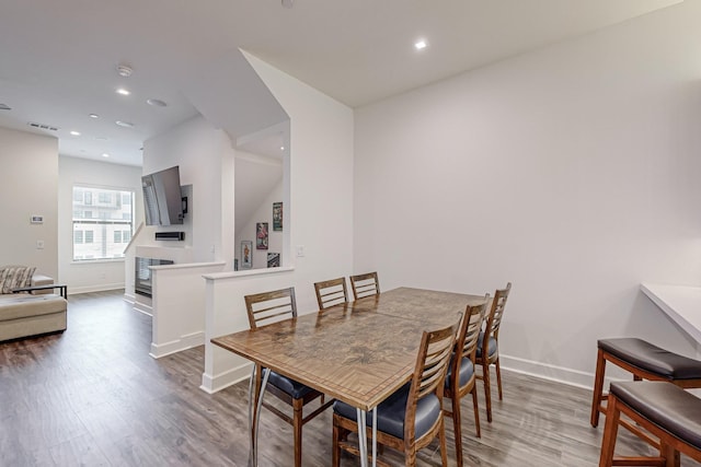 1813 Park Ave Unit 204, Dallas, TX 75215 - dining room featuring wood finished floors, baseboards, and recessed lighting