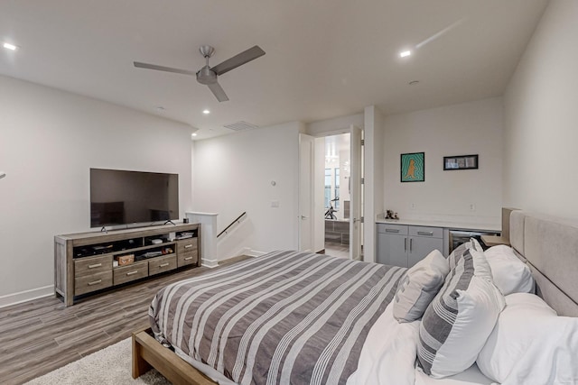 1813 Park Ave Unit 204, Dallas, TX 75215 - bedroom featuring light wood-type flooring, ceiling fan, a bar, and recessed lighting