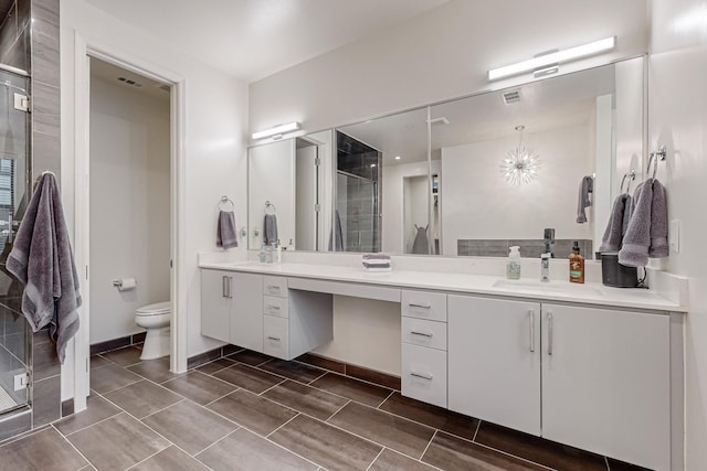 1813 Park Ave Unit 204, Dallas, TX 75215 - full bath with double vanity, a shower stall, toilet, and baseboards