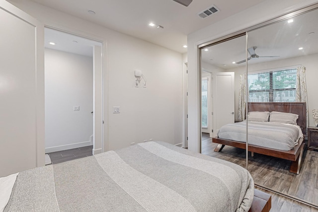 1813 Park Ave Unit 204, Dallas, TX 75215 - bedroom with wood finished floors, recessed lighting, a closet, a ceiling fan, and baseboards