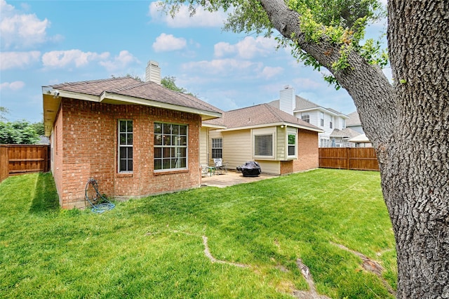2300 Kittyhawk Dr, Plano, TX 75025 - back of house featuring brick siding, a patio, and a chimney