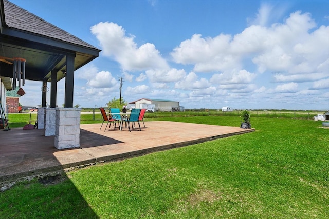 205 N Armstrong Rd, Venus, TX 76084 - view of grassy yard with a patio area