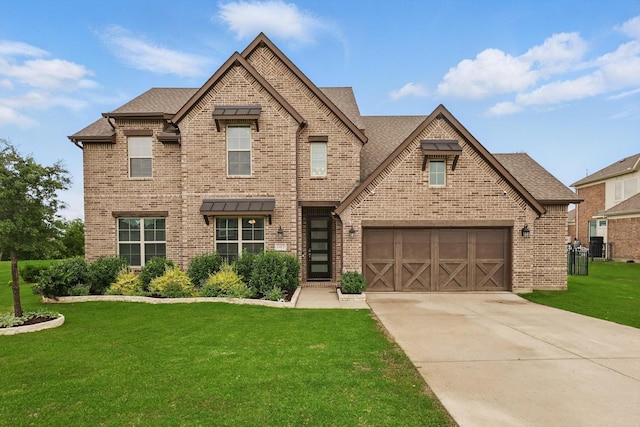 1412 Wolf Ridge Run, Gunter, TX 75058 - view of front facade featuring brick siding, a front lawn, concrete driveway, a garage, and roof with shingles