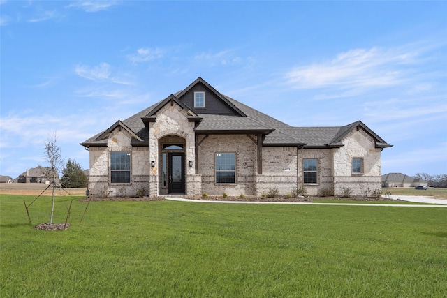 6013 Valley View Dr, Joshua, TX 76058 - french country home with roof with shingles, a front lawn, stone siding, and brick siding