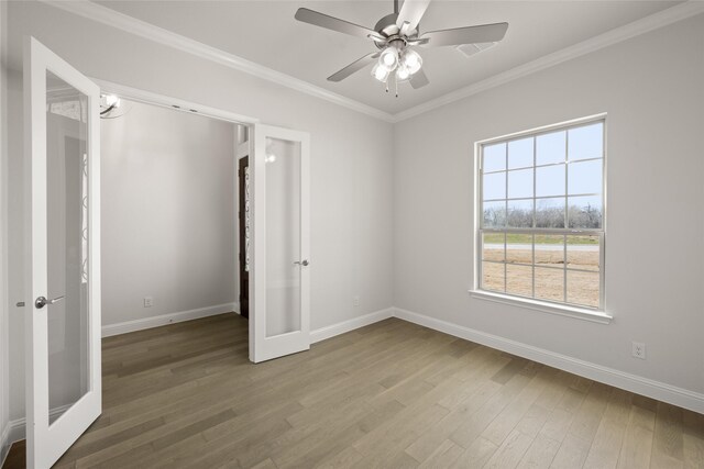 6013 Valley View Dr, Joshua, TX 76058 - unfurnished room featuring french doors, wood finished floors, baseboards, ornamental molding, and ceiling fan