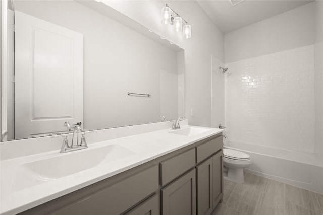 6013 Valley View Dr, Joshua, TX 76058 - full bathroom featuring toilet, double vanity, and bathtub / shower combination