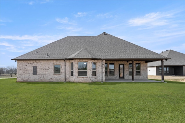 6013 Valley View Dr, Joshua, TX 76058 - back of property featuring a patio, a yard, a shingled roof, and brick siding