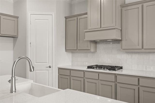 6013 Valley View Dr, Joshua, TX 76058 - kitchen featuring gray cabinetry, stainless steel gas cooktop, crown molding, and a sink
