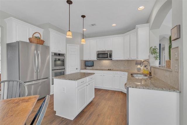 3712 Stockport Dr, Plano, TX 75025 - kitchen with stainless steel appliances, a sink, light stone counters, white cabinetry, and recessed lighting