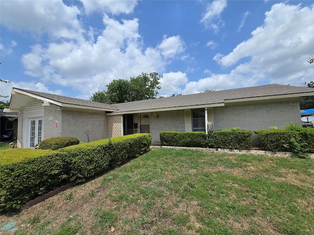 3137 Lariat Ln, Garland, TX 75042 - ranch-style home featuring brick siding and a front yard